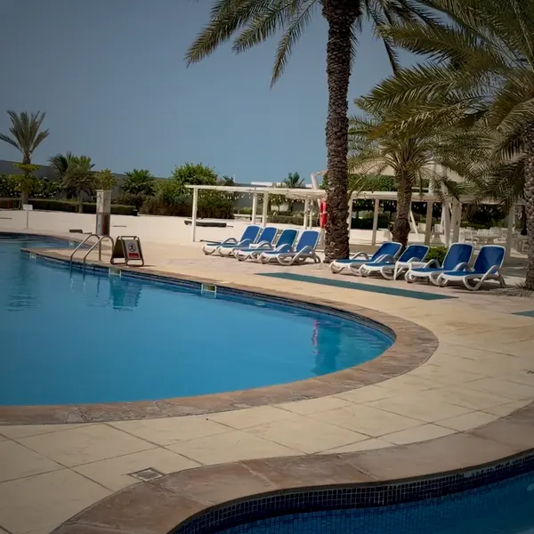 The curved pool edge at Al Hamra Residence, footage by Kay
